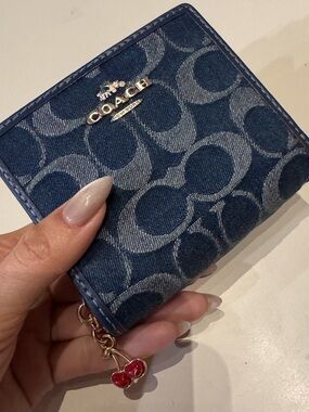 Coach Denim Monogram Compact Wallet with Red Cherry Charm